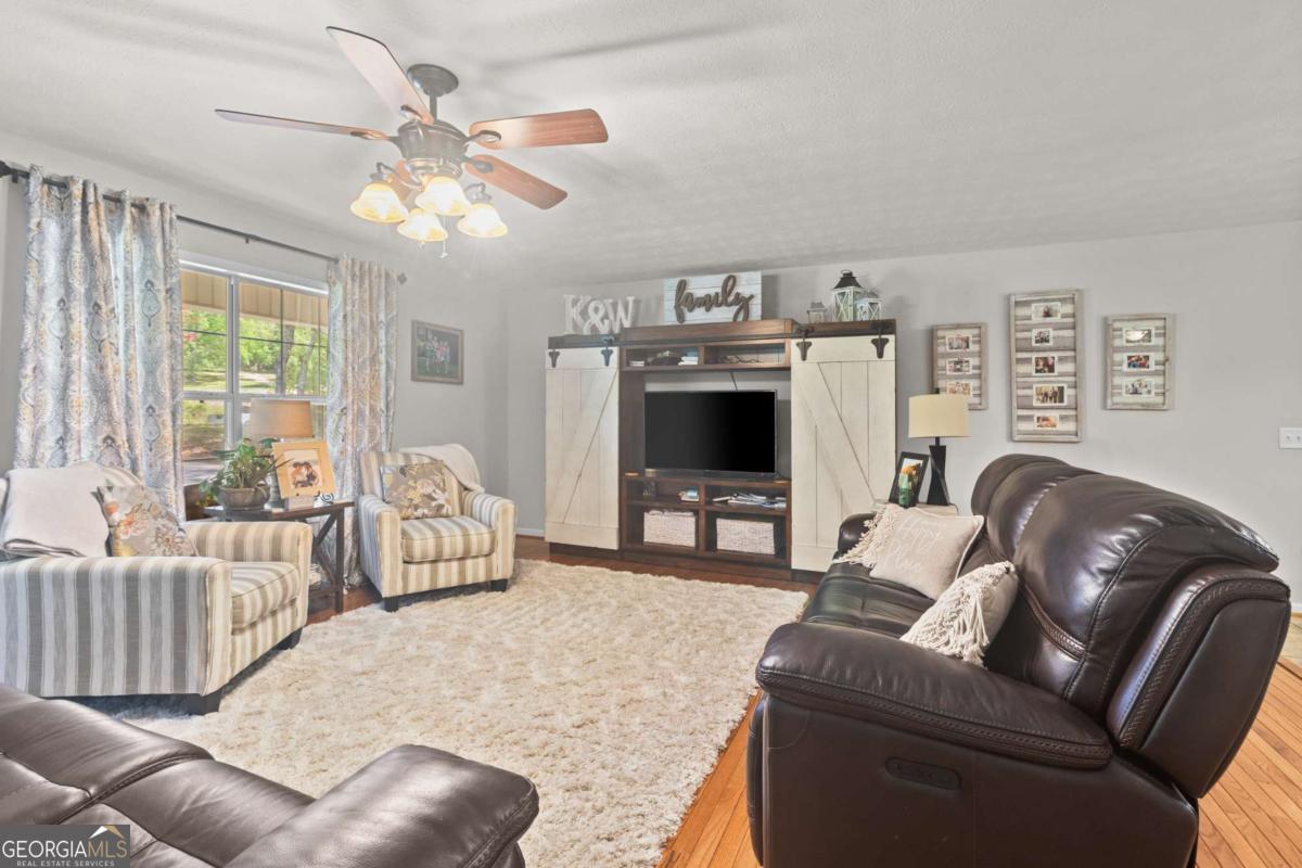 513 South Red Rock Road Toccoa, GA 30577 - Photo 13 of 47 a living room with furniture and a flat screen tv