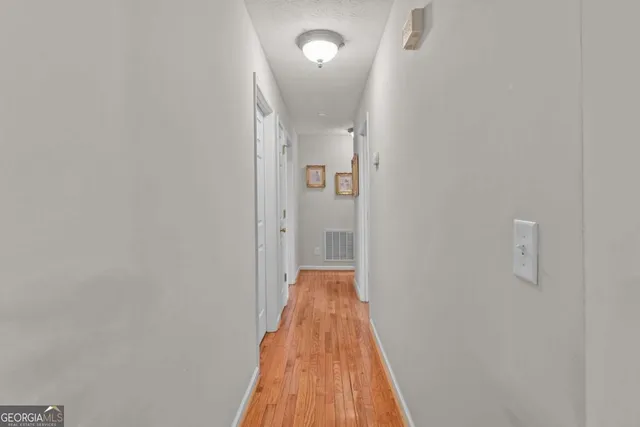 a living room with a couch and a bookshelf