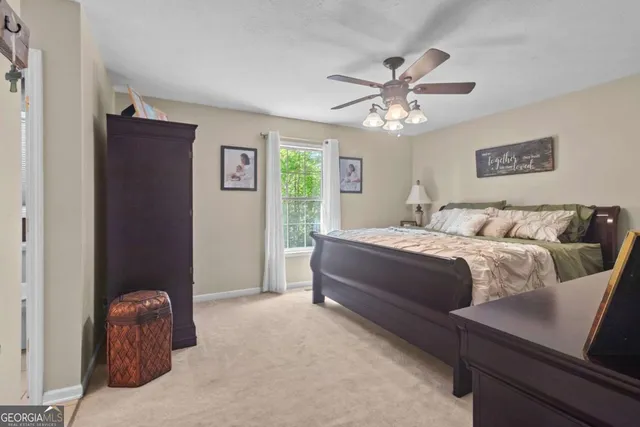 a bedroom with a bed and window