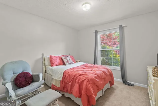 a bathroom with a double vanity sink mirror and shower