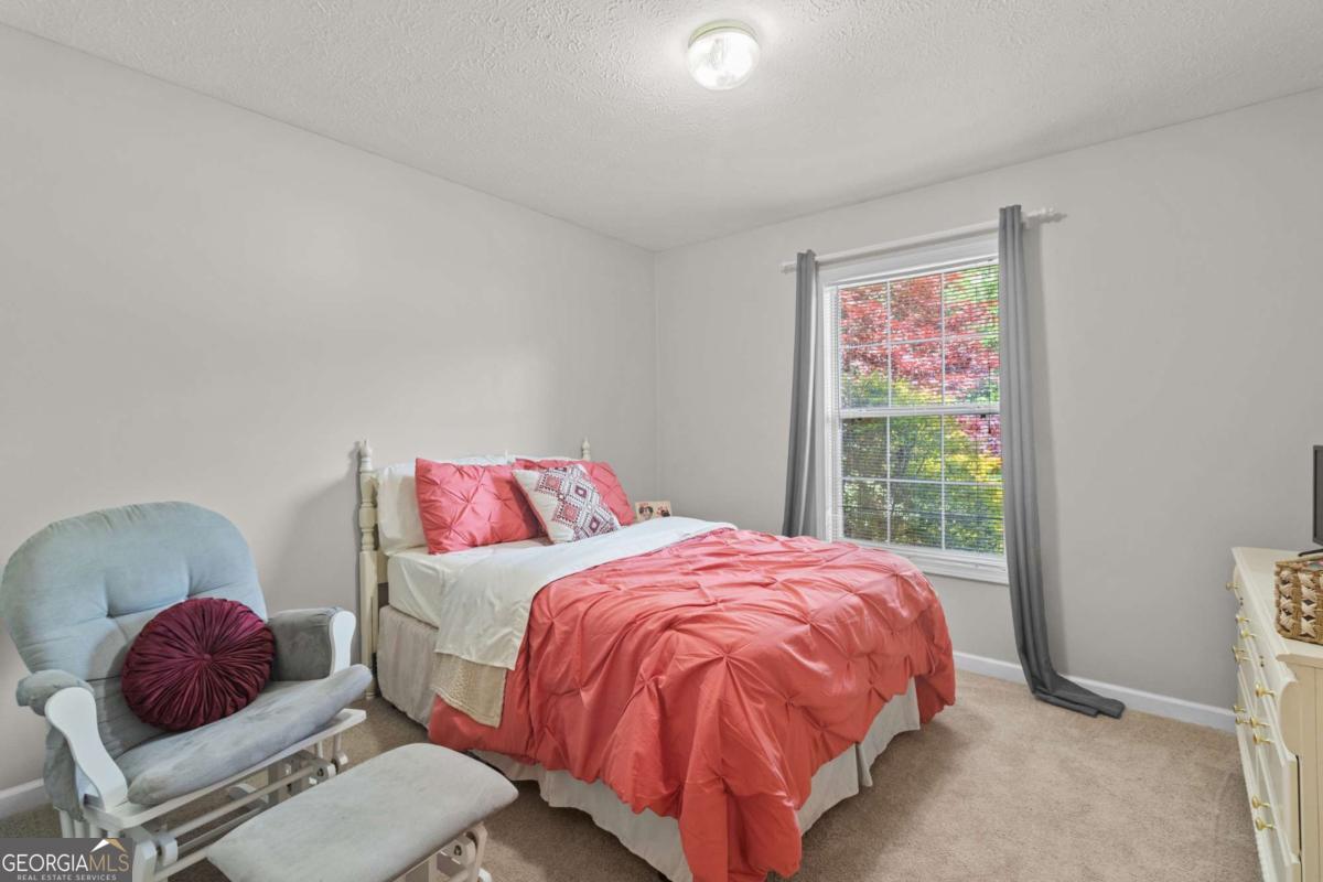 513 South Red Rock Road Toccoa, GA 30577 - Photo 24 of 47 a bedroom with a bed and window