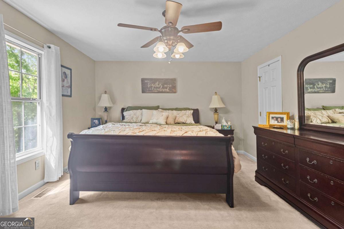 513 South Red Rock Road Toccoa, GA 30577 - Photo 26 of 47 a spacious bedroom with a bed and a dresser