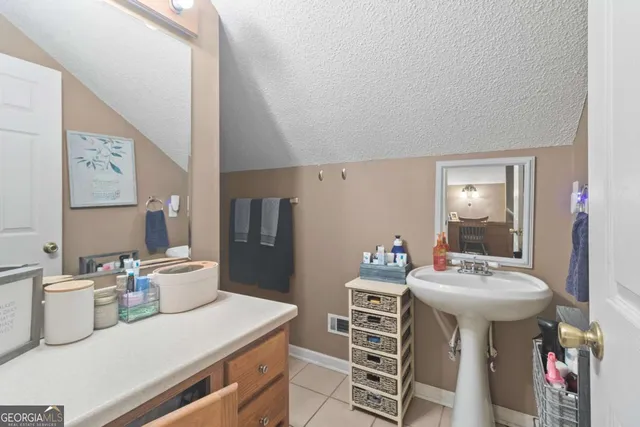 a bedroom with a bed a desk and chair