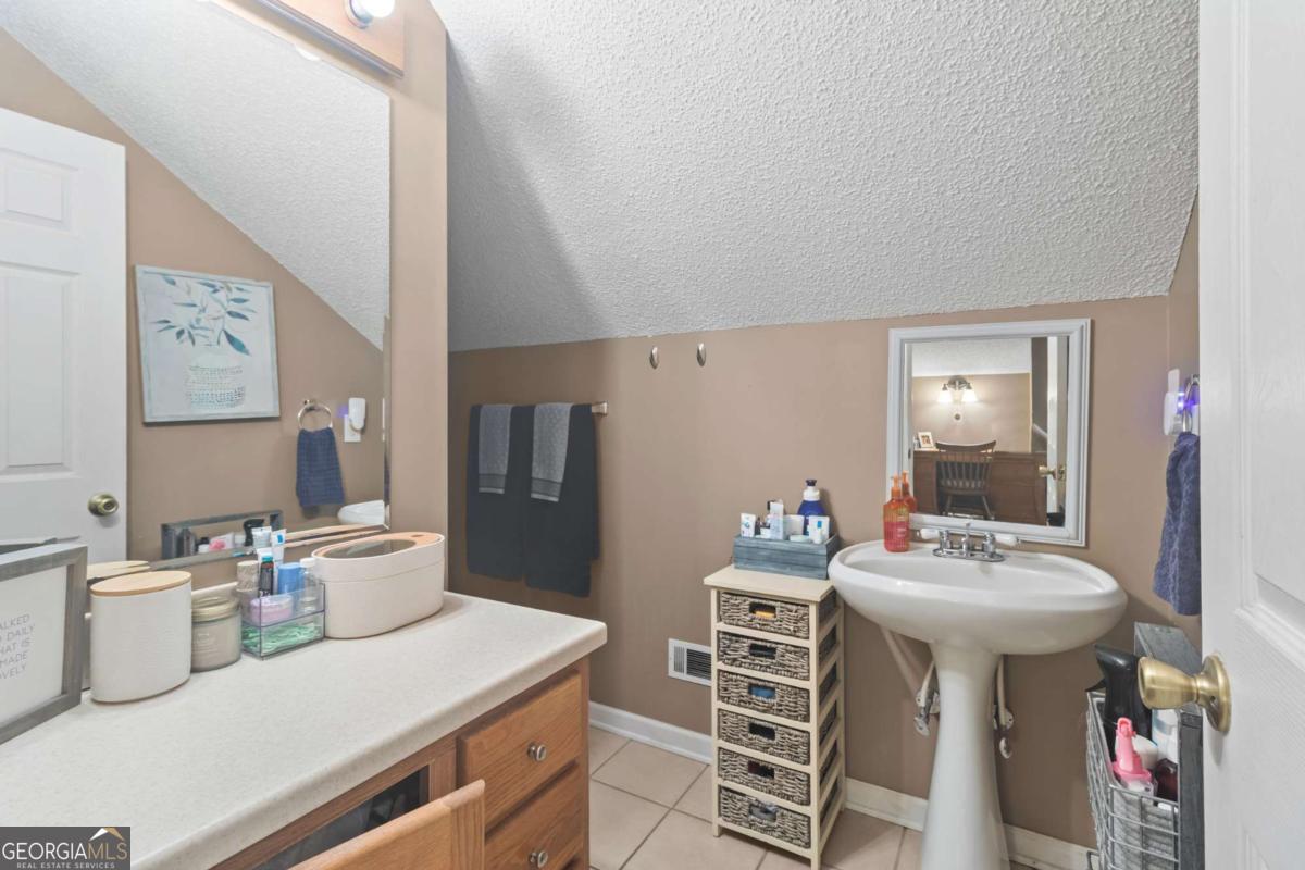 513 South Red Rock Road Toccoa, GA 30577 - Photo 30 of 47 a kitchen with a sink and chairs
