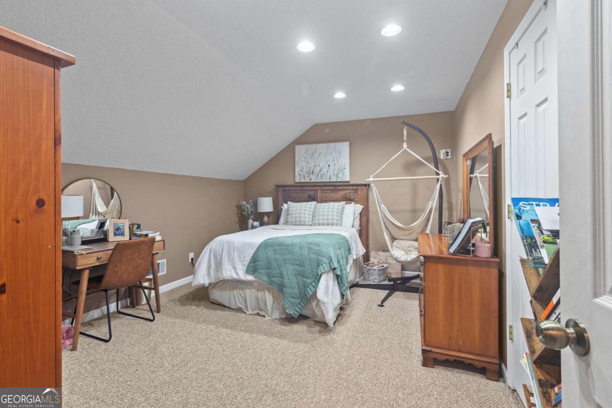 513 South Red Rock Road Toccoa, GA 30577 - Photo 31 of 47 a bedroom with a bed a desk and chair