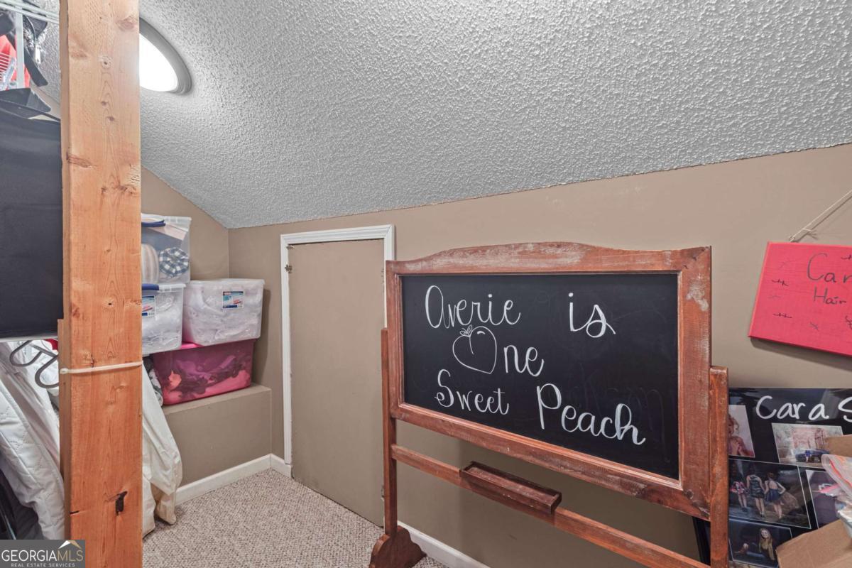 513 South Red Rock Road Toccoa, GA 30577 - Photo 37 of 47 a view of outdoor space with signage and flags