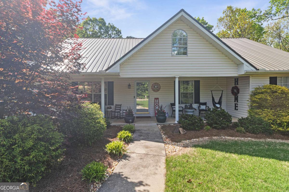 513 South Red Rock Road Toccoa, GA 30577 - Photo 6 of 47 a front view of a house with garden
