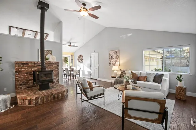 a living room with furniture fireplace and a flat screen tv