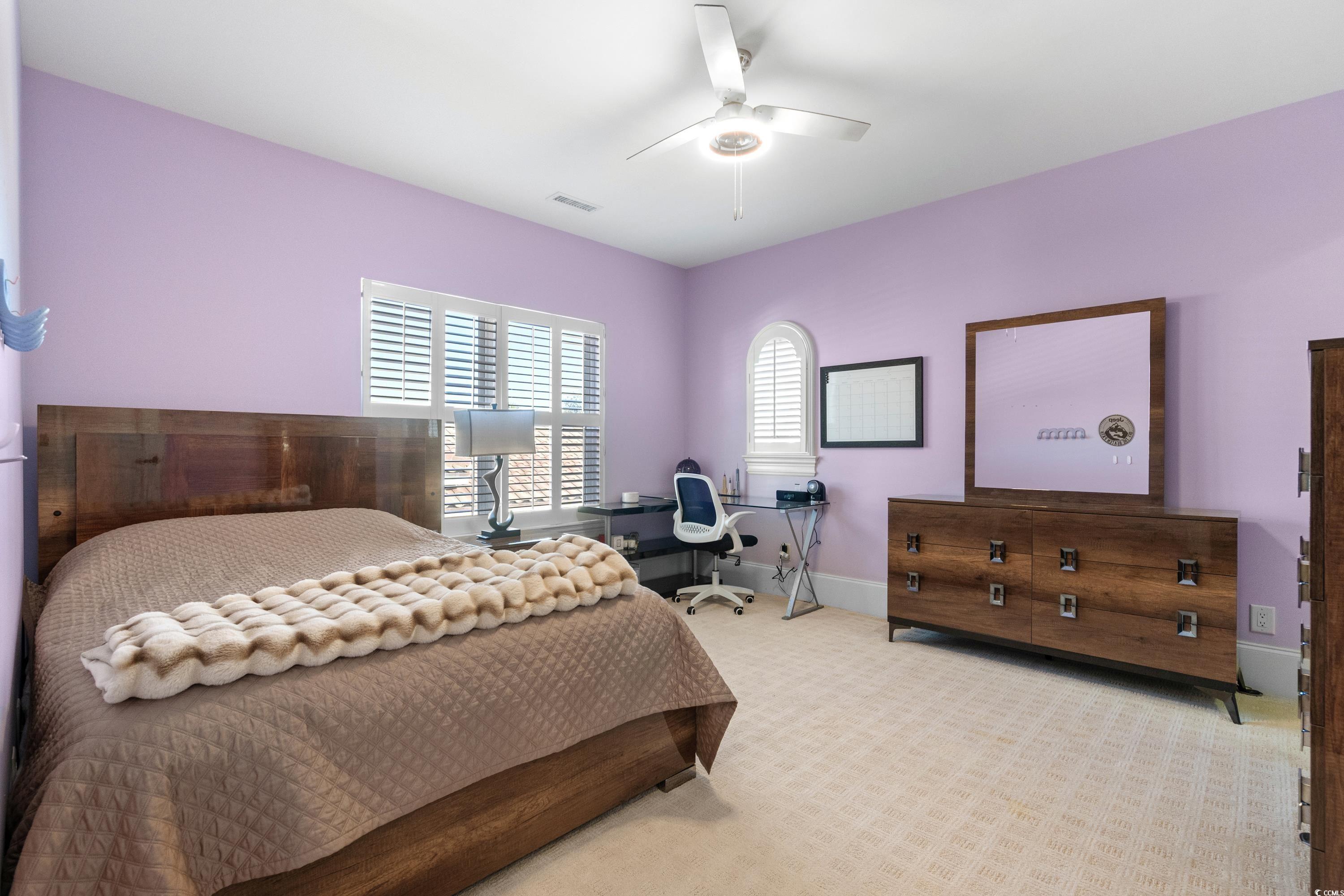 9237 Bellasera Circle Myrtle Beach, SC 29579 - Photo 24 of 34 Bedroom with light carpet and ceiling fan