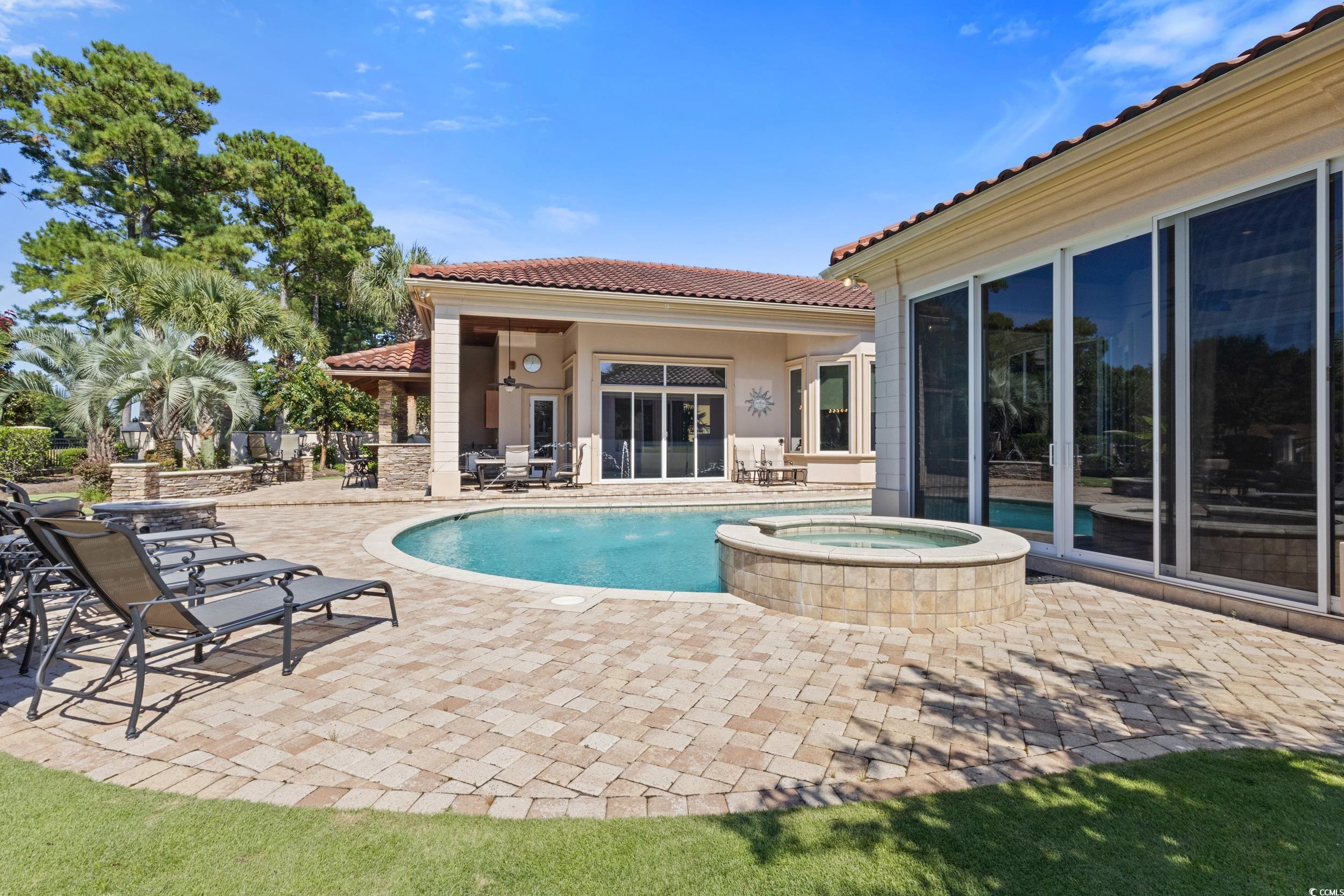9237 Bellasera Circle Myrtle Beach, SC 29579 - Photo 30 of 34 View of pool featuring a patio and a pool with connected hot tub