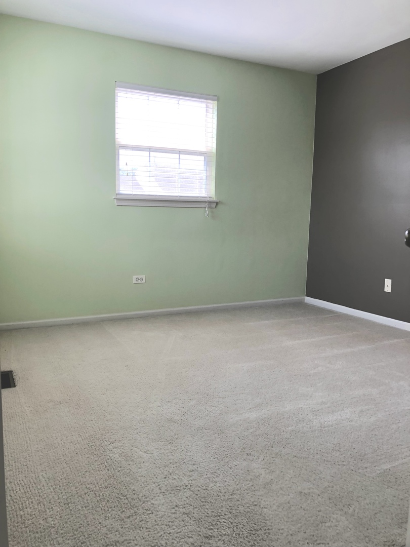 2330 Sheehan Drive Naperville, IL 60564 - Photo 14 of 18 an empty room with a window