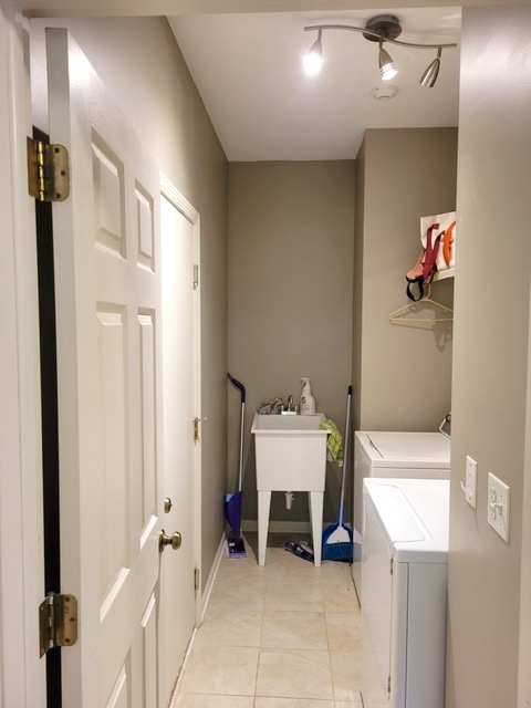 2330 Sheehan Drive Naperville, IL 60564 - Photo 16 of 18 a bathroom with a sink and a mirror