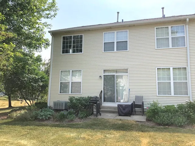 a view of a house with swimming pool and porch