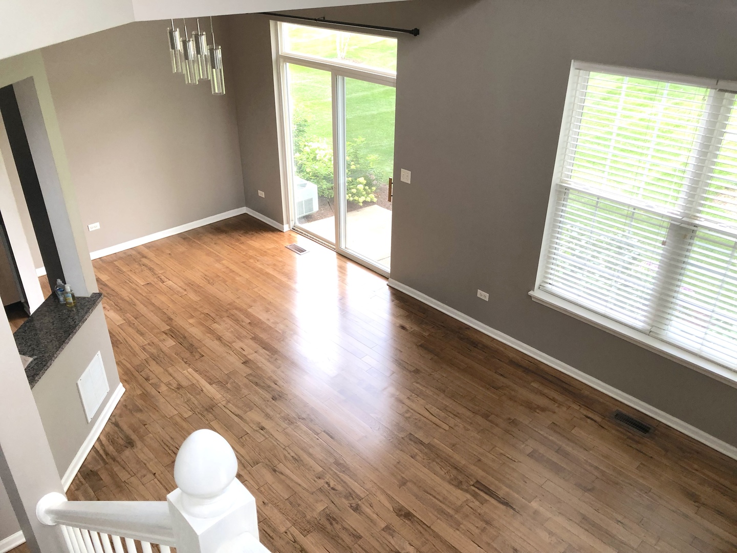 2330 Sheehan Drive Naperville, IL 60564 - Photo 8 of 18 a view of an empty room with wooden floor and a window