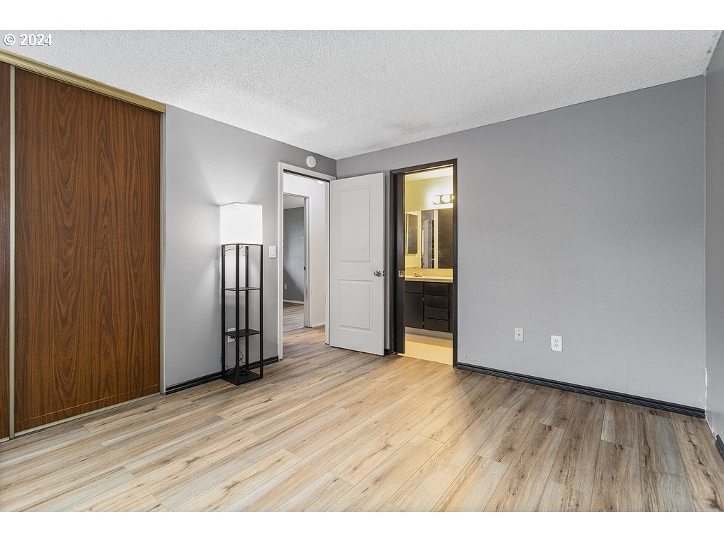 2772 Southwest 18th Place Gresham, OR 97080 - Photo 11 of 16 a view of an empty room with wooden floor