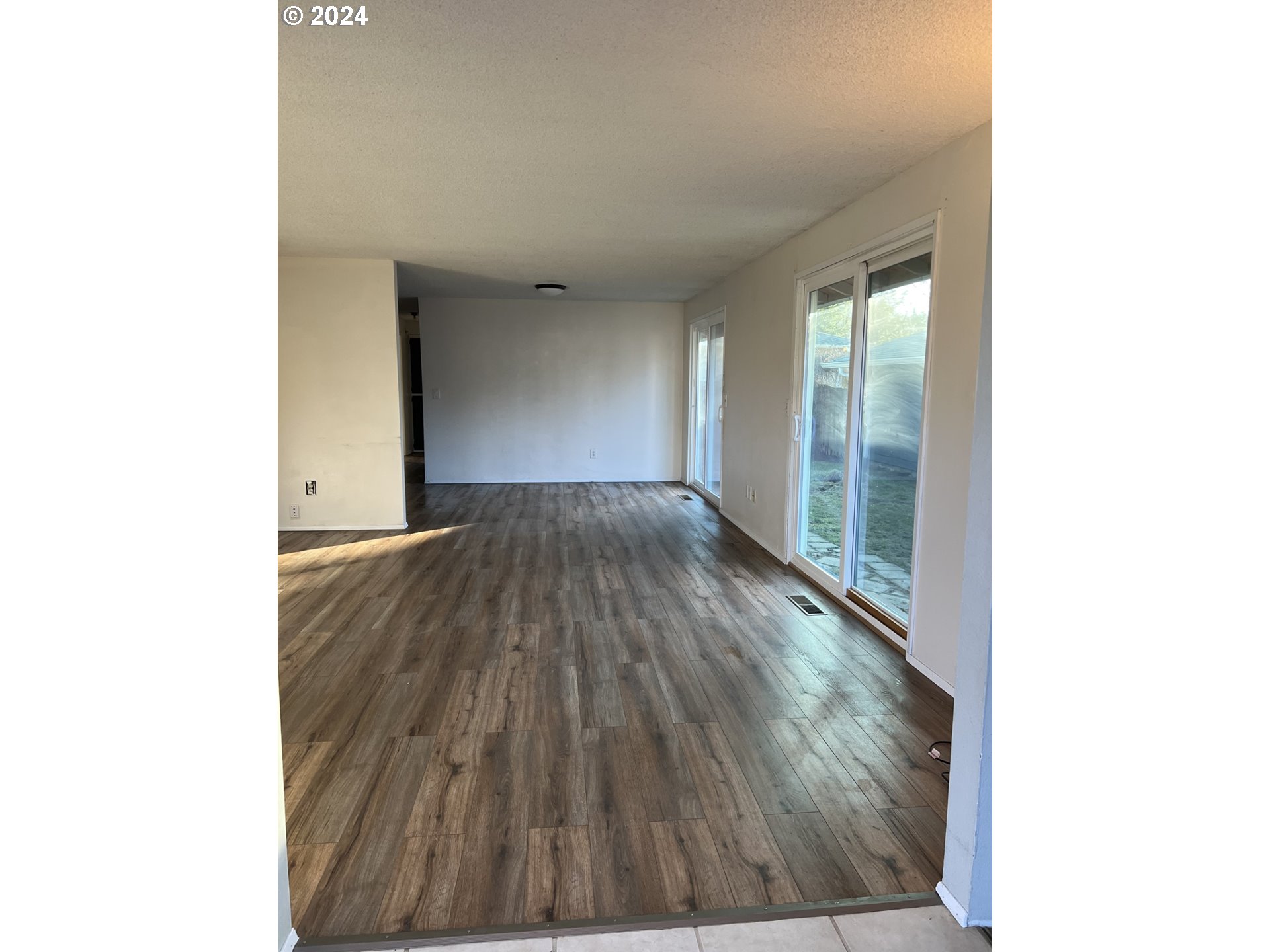 2772 Southwest 18th Place Gresham, OR 97080 - Photo 2 of 16 a view of a room with wooden floor