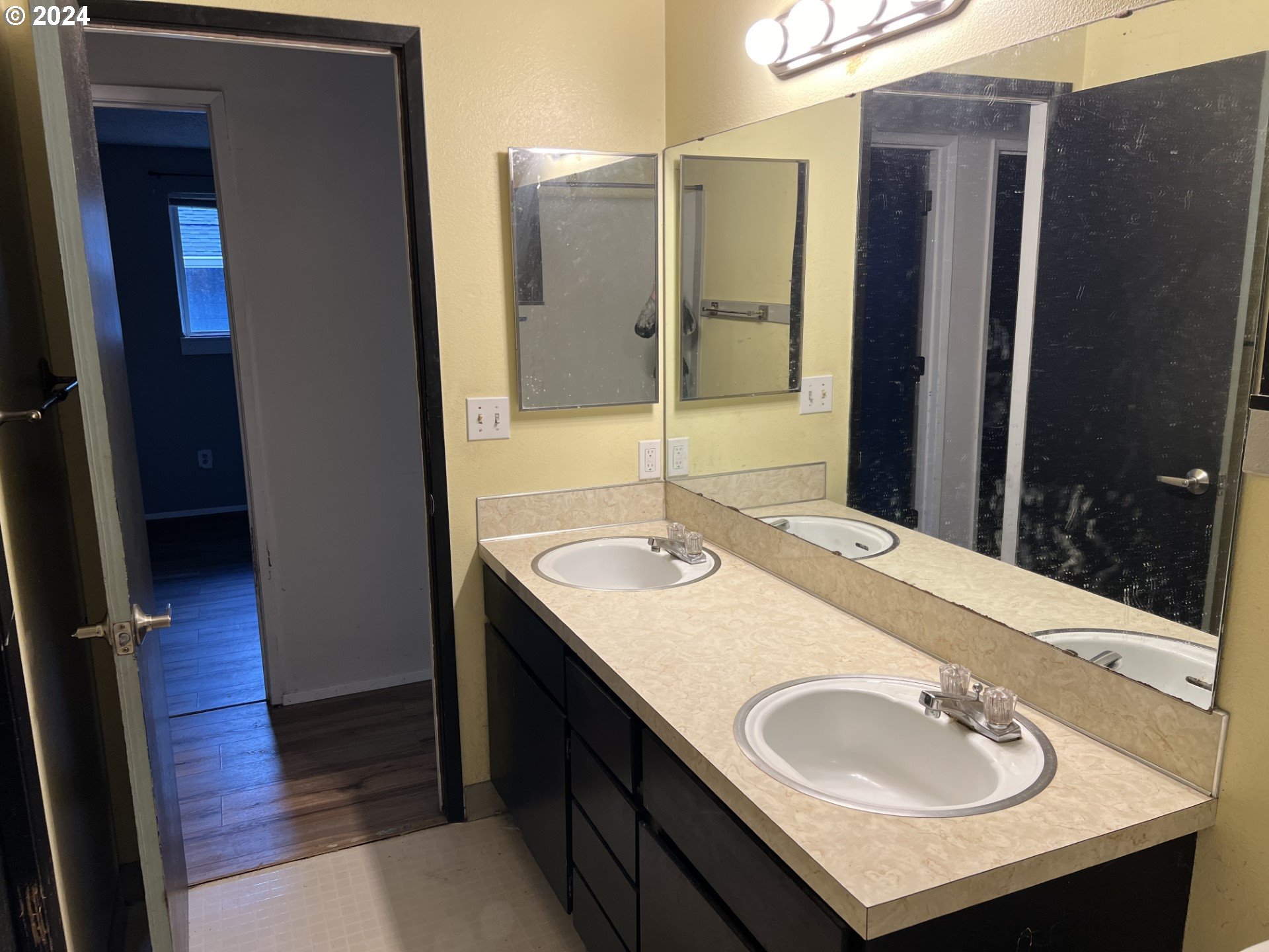 2772 Southwest 18th Place Gresham, OR 97080 - Photo 4 of 16 a bathroom with a sink and a mirror