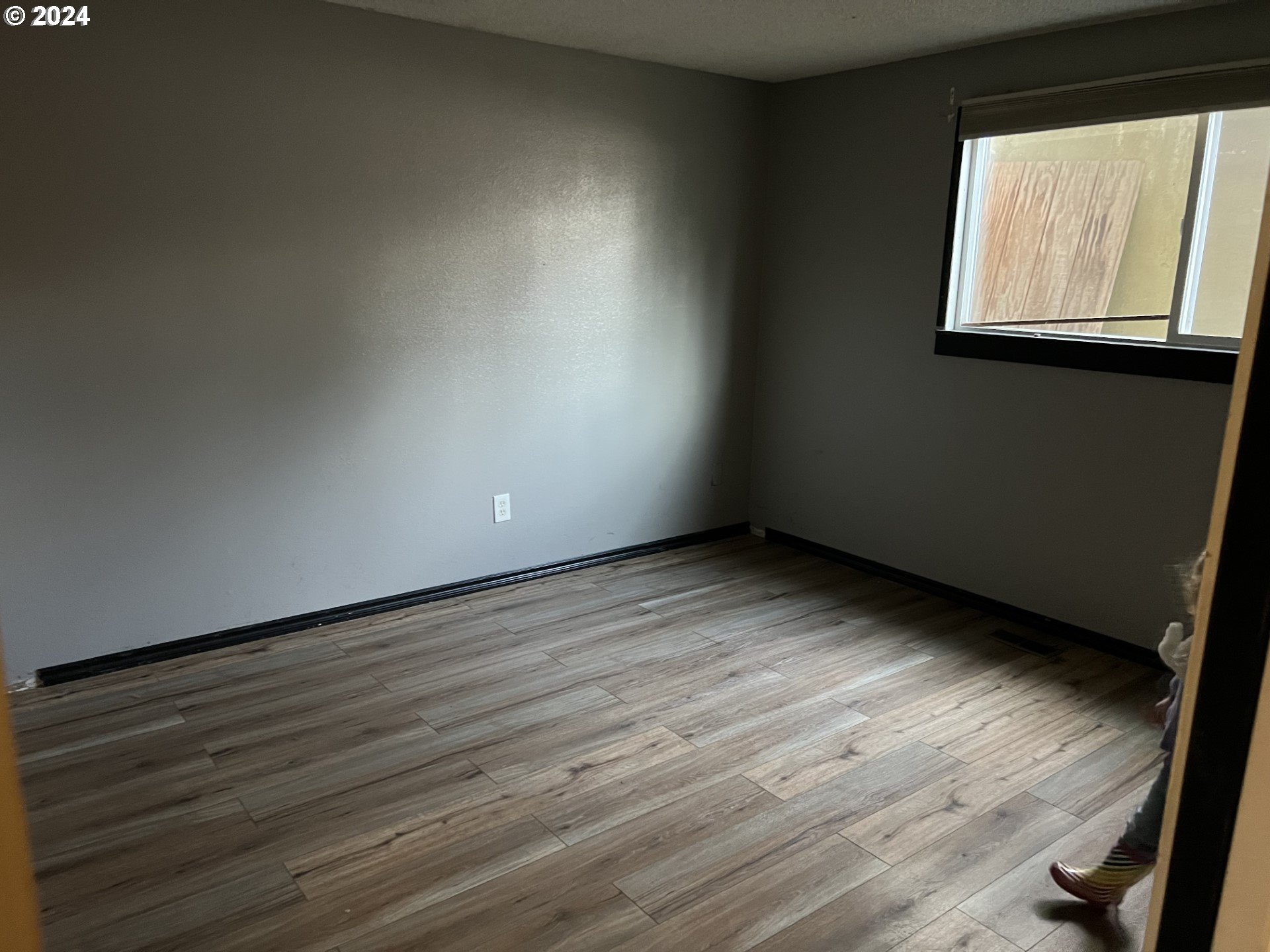 2772 Southwest 18th Place Gresham, OR 97080 - Photo 7 of 16 a view of an empty room and wooden floor