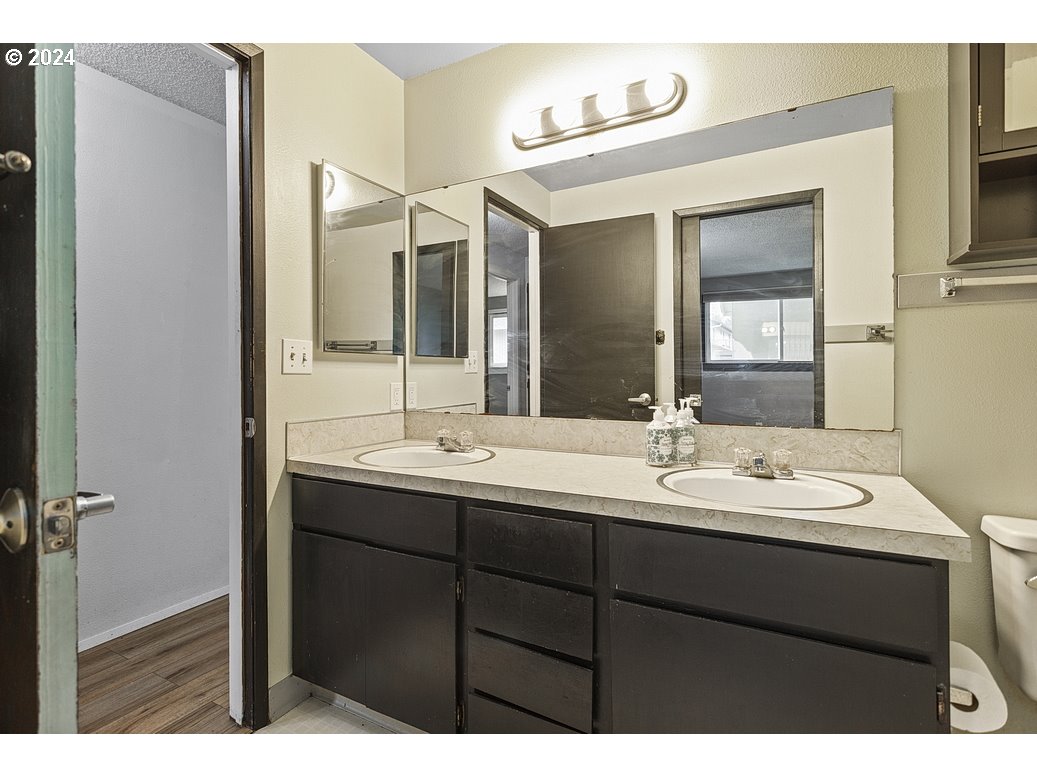2772 Southwest 18th Place Gresham, OR 97080 - Photo 10 of 16 a bathroom with a double vanity sink mirror and