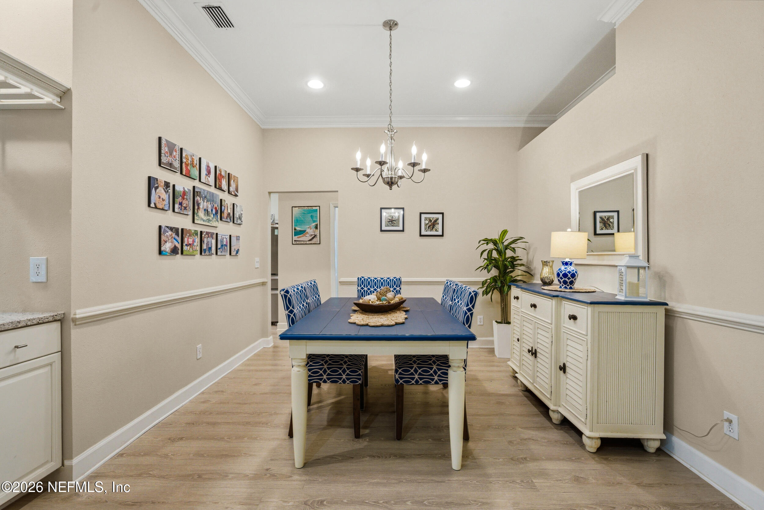118 3rd Street St. Augustine, FL 32084 - Photo 15 of 77 a view of a dining room with furniture and chandelier