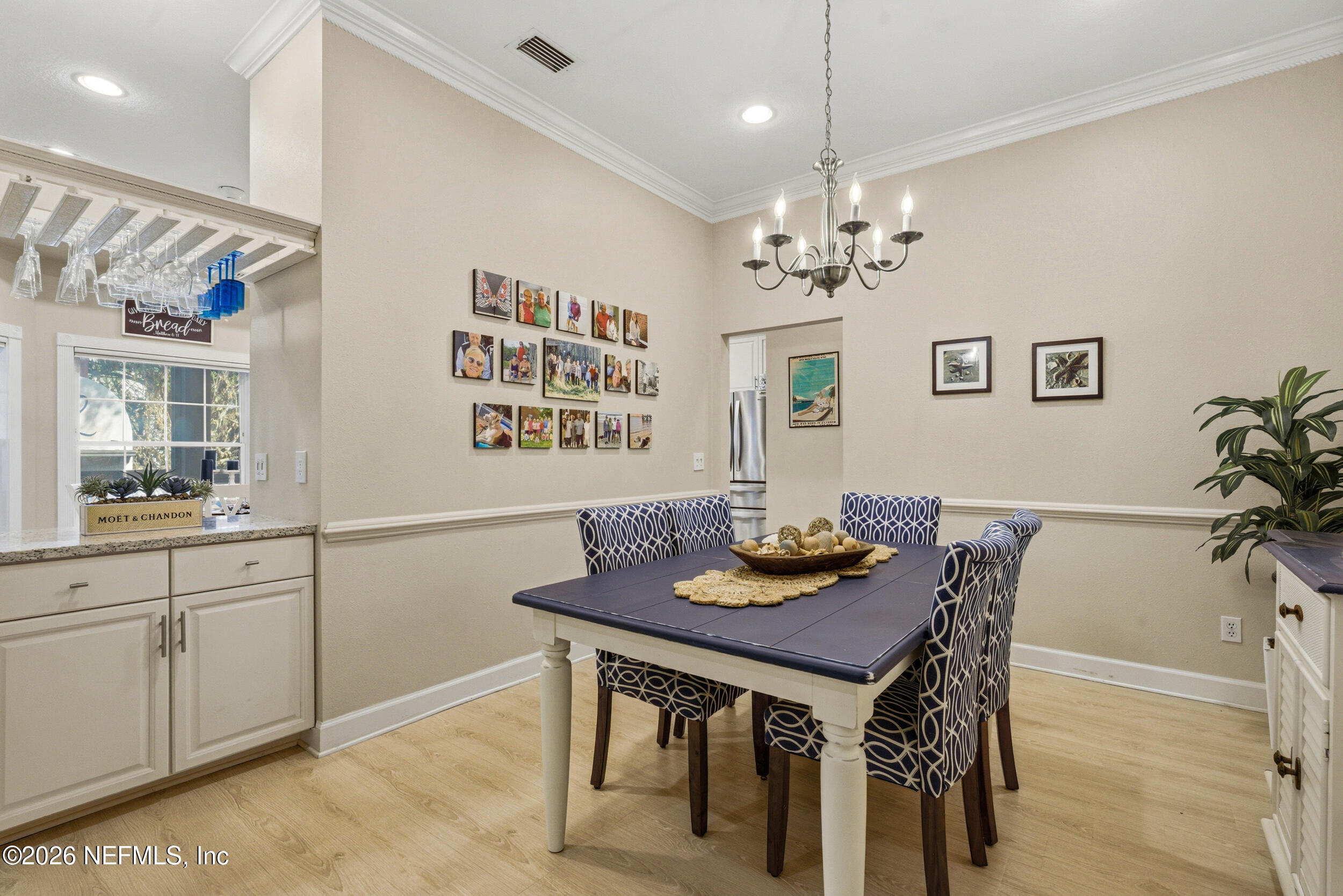 118 3rd Street St. Augustine, FL 32084 - Photo 16 of 77 a view of a kitchen area with furniture and chandelier