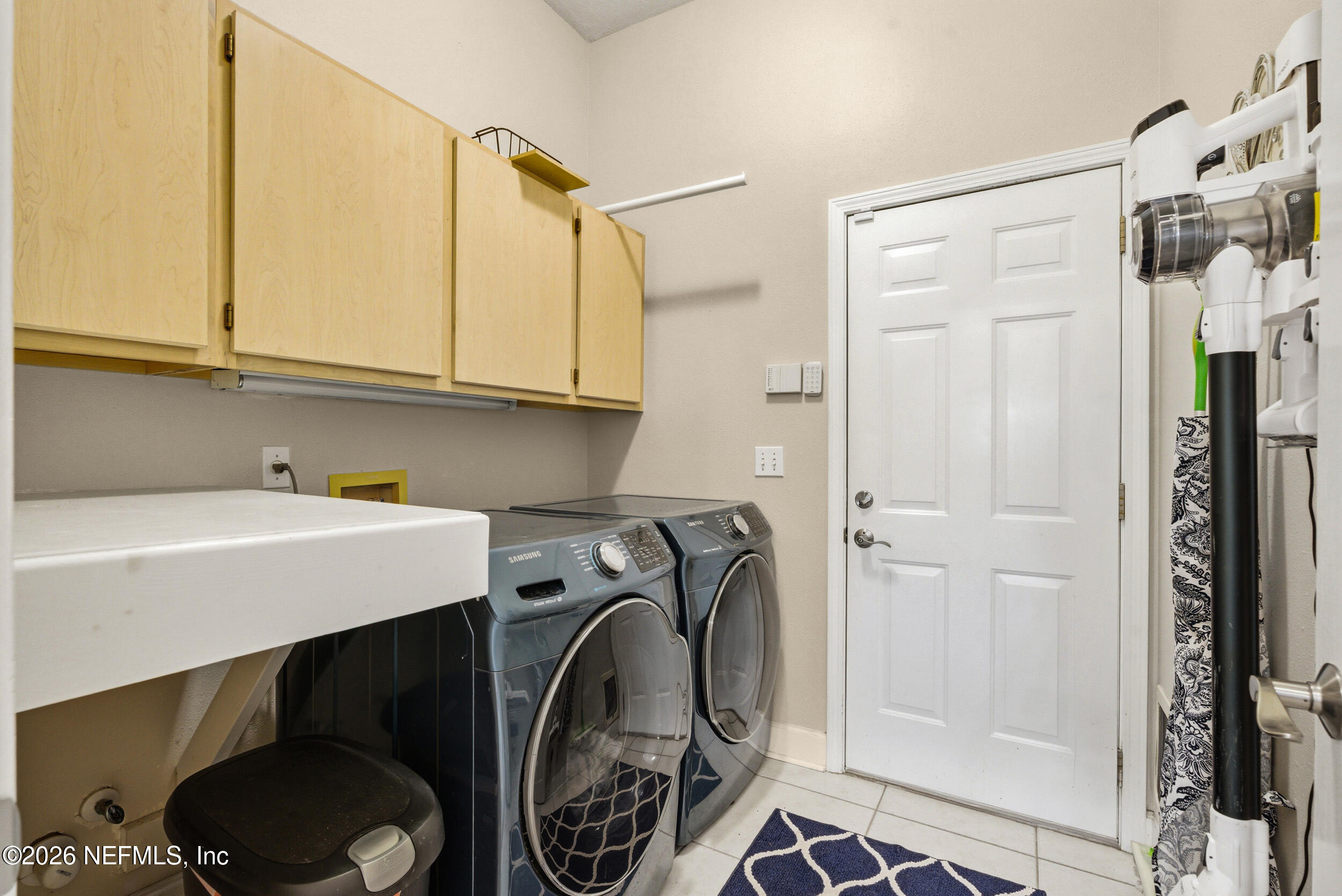 118 3rd Street St. Augustine, FL 32084 - Photo 18 of 77 a utility room with dryer and washer