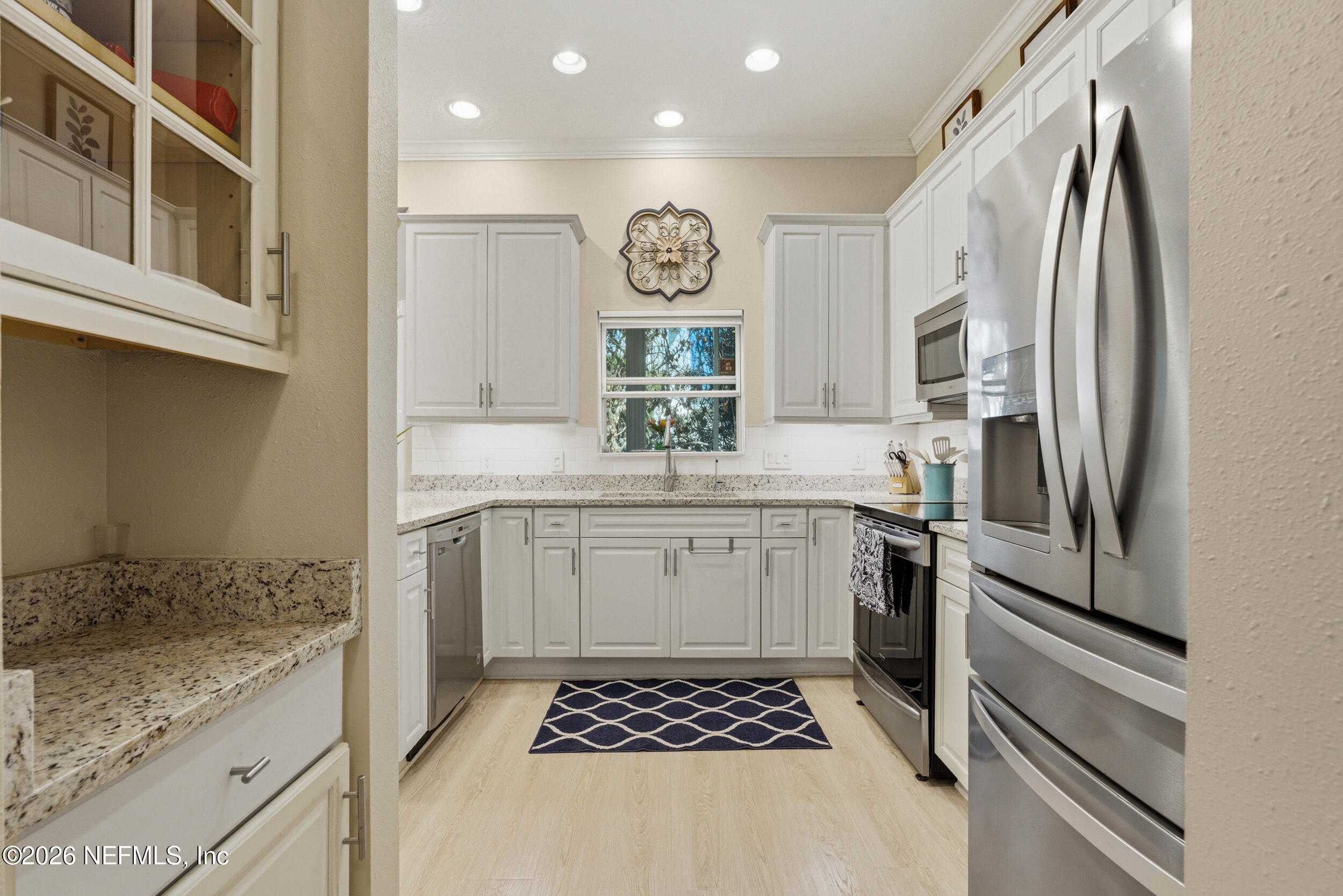 118 3rd Street St. Augustine, FL 32084 - Photo 20 of 77 a kitchen with a refrigerator and a sink