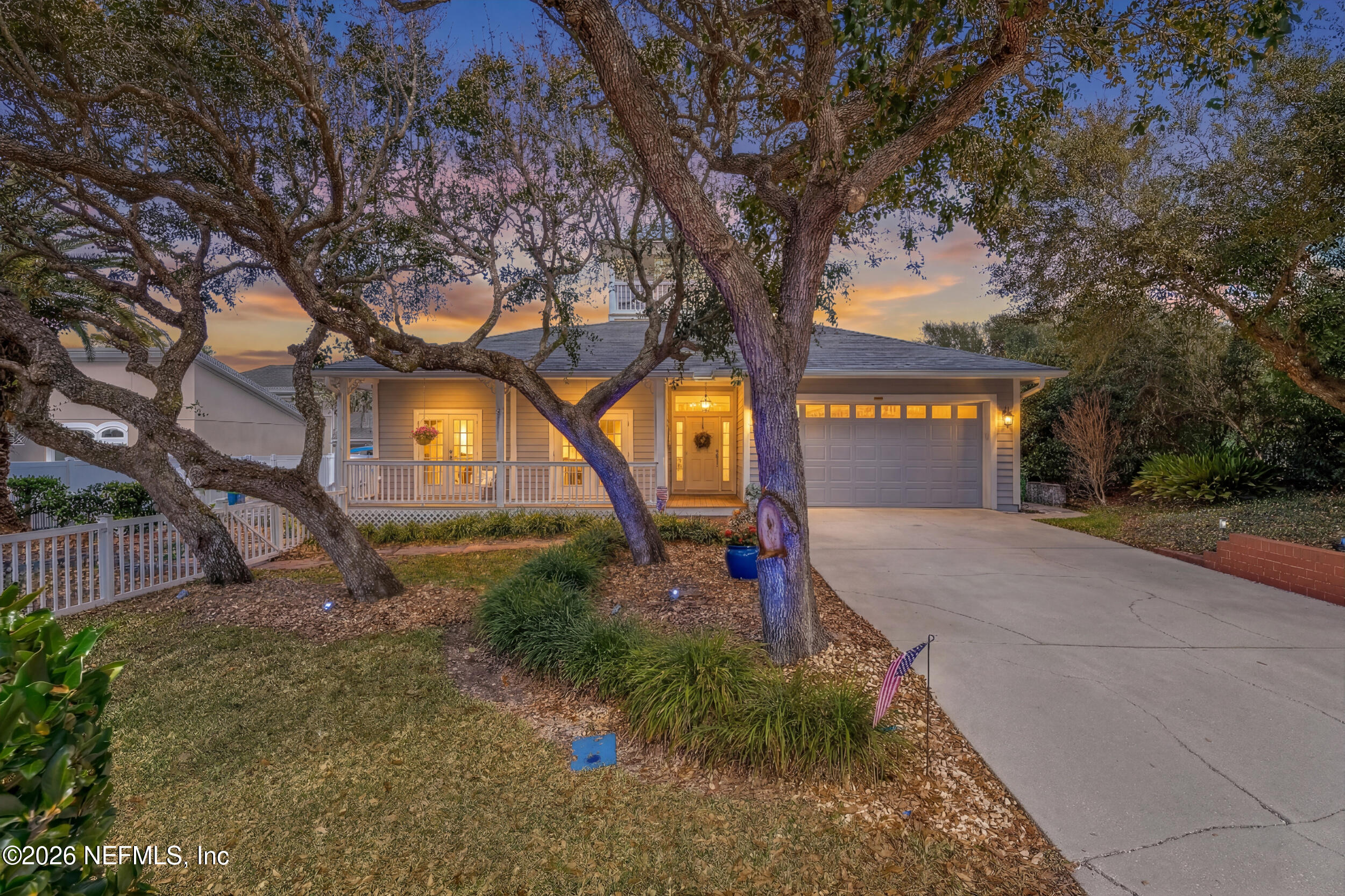 118 3rd Street St. Augustine, FL 32084 - Photo 2 of 77 a front view of a house with a yard and tree s