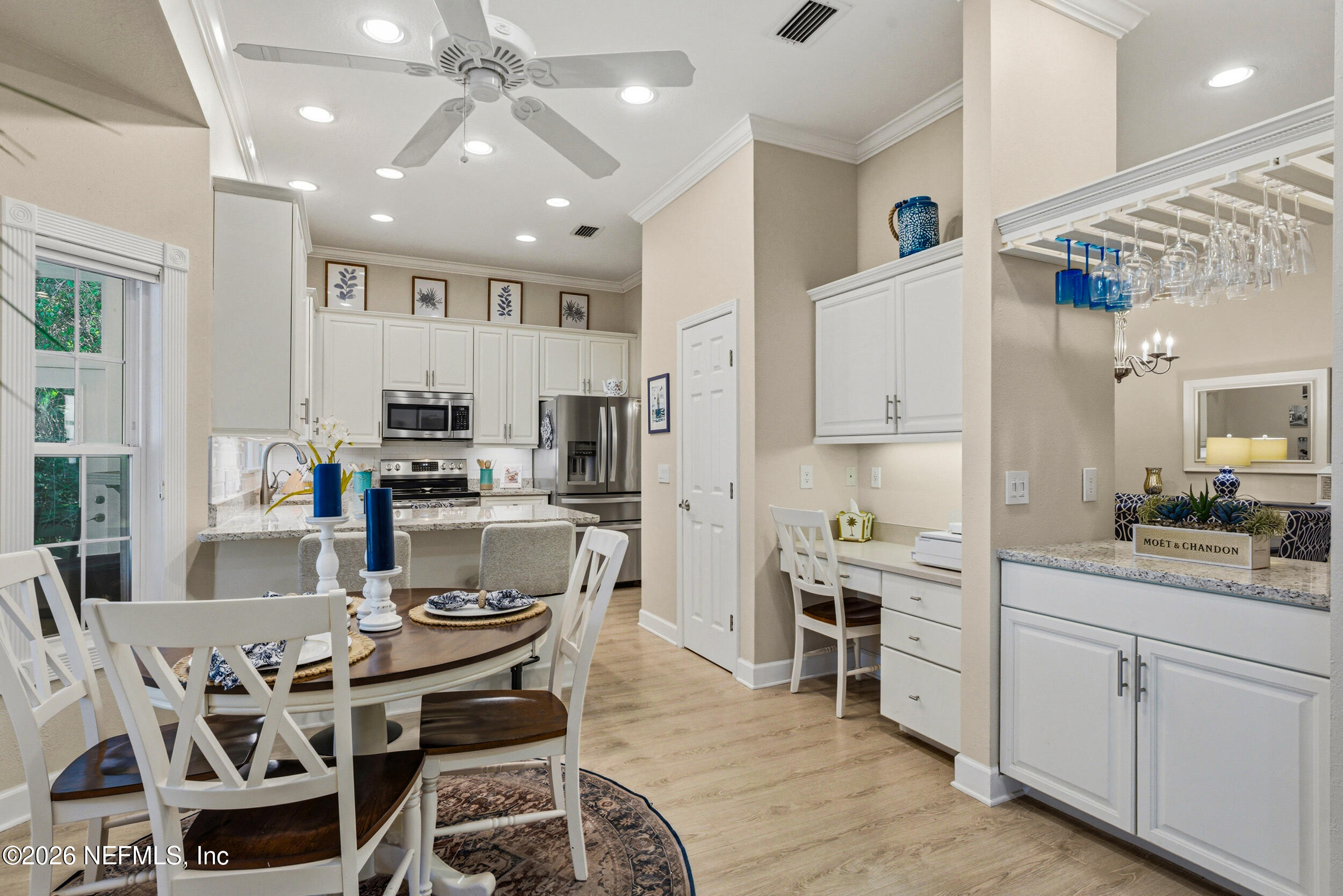 118 3rd Street St. Augustine, FL 32084 - Photo 24 of 77 a kitchen with stainless steel appliances kitchen island granite countertop a sink and cabinets