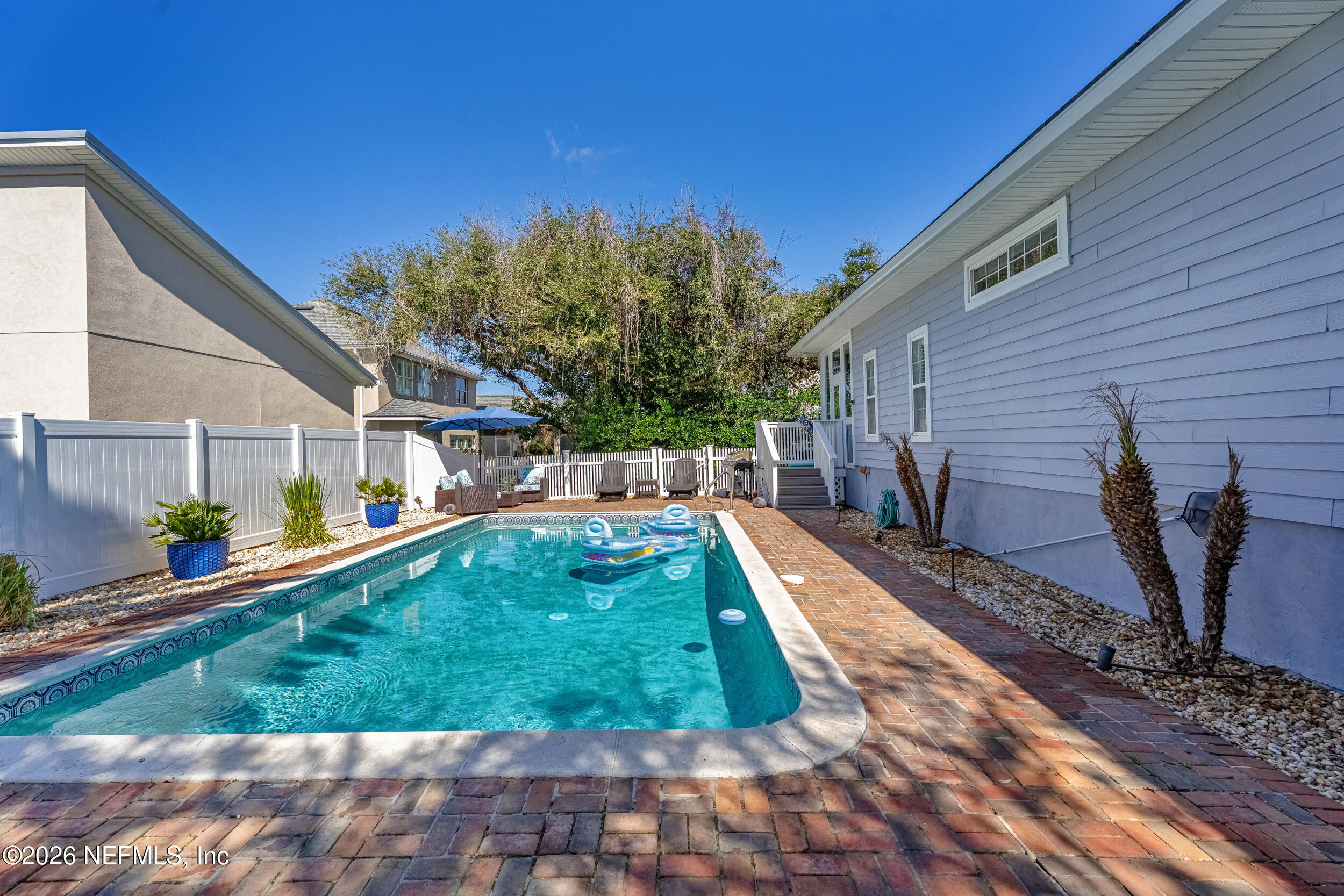 118 3rd Street St. Augustine, FL 32084 - Photo 3 of 77 a view of a porch with a yard