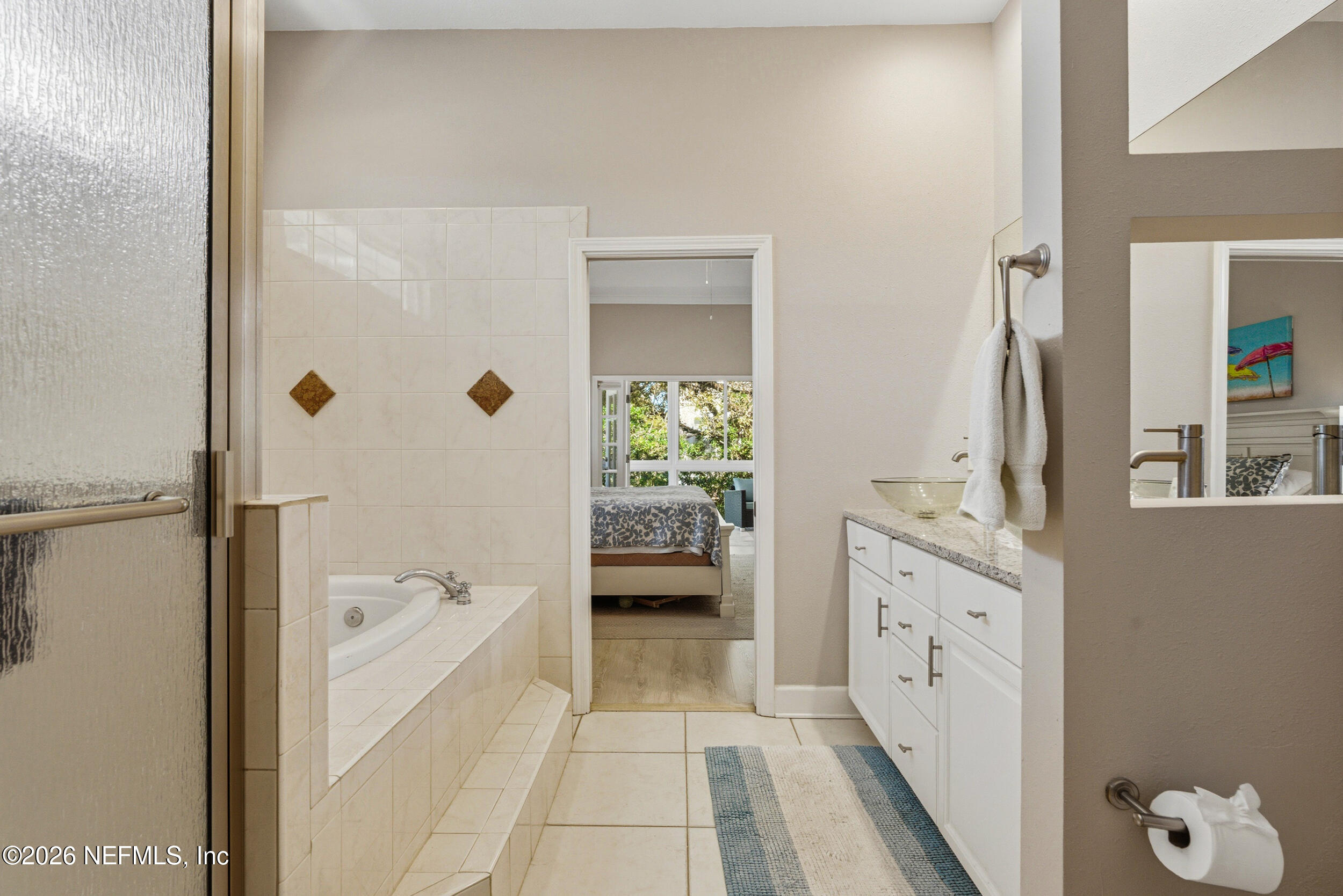 118 3rd Street St. Augustine, FL 32084 - Photo 34 of 77 a bathroom with a tub shower and a sink