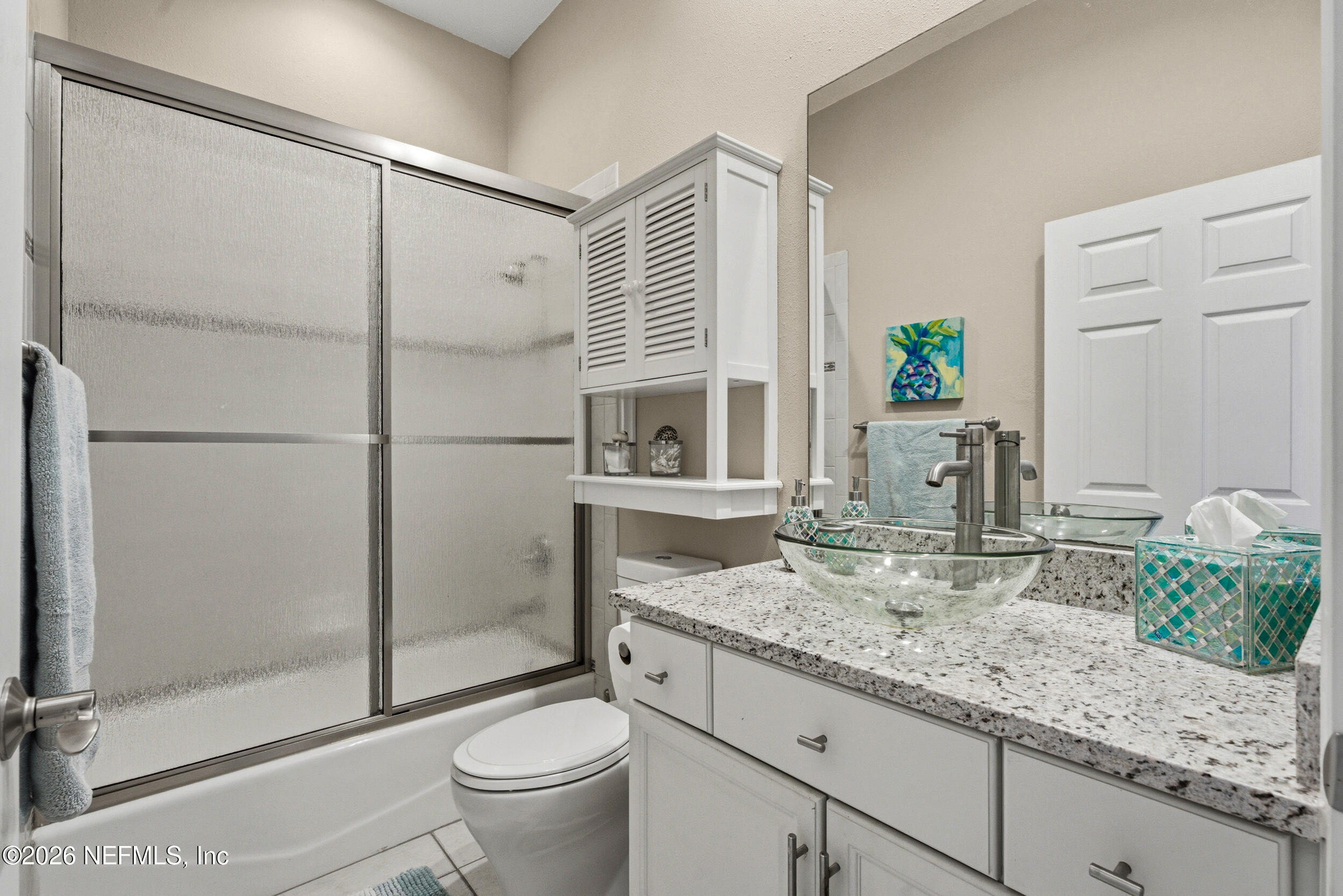118 3rd Street St. Augustine, FL 32084 - Photo 36 of 77 a bathroom with a granite countertop sink a toilet and shower