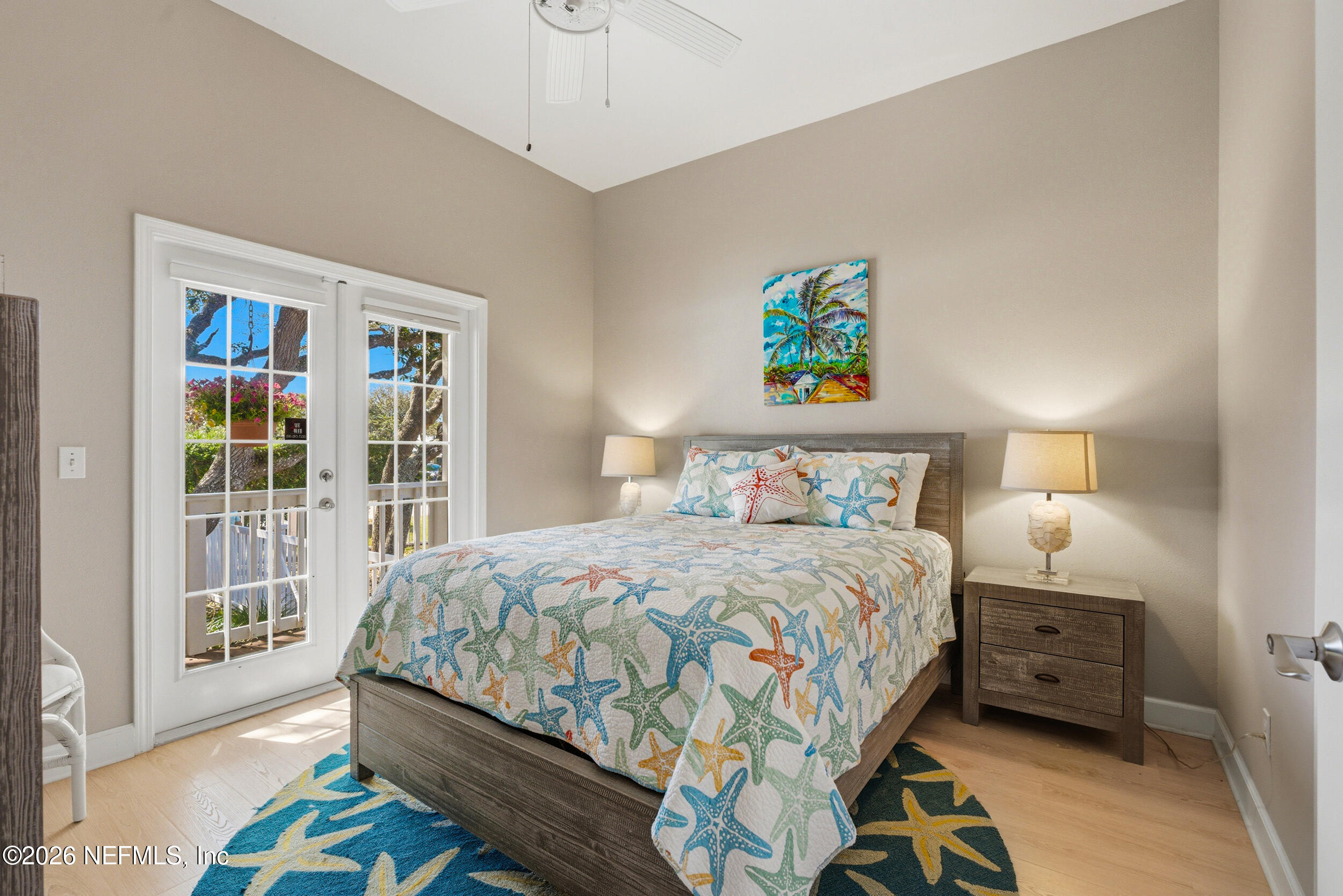 118 3rd Street St. Augustine, FL 32084 - Photo 39 of 77 a bedroom with a bed a stove and a window