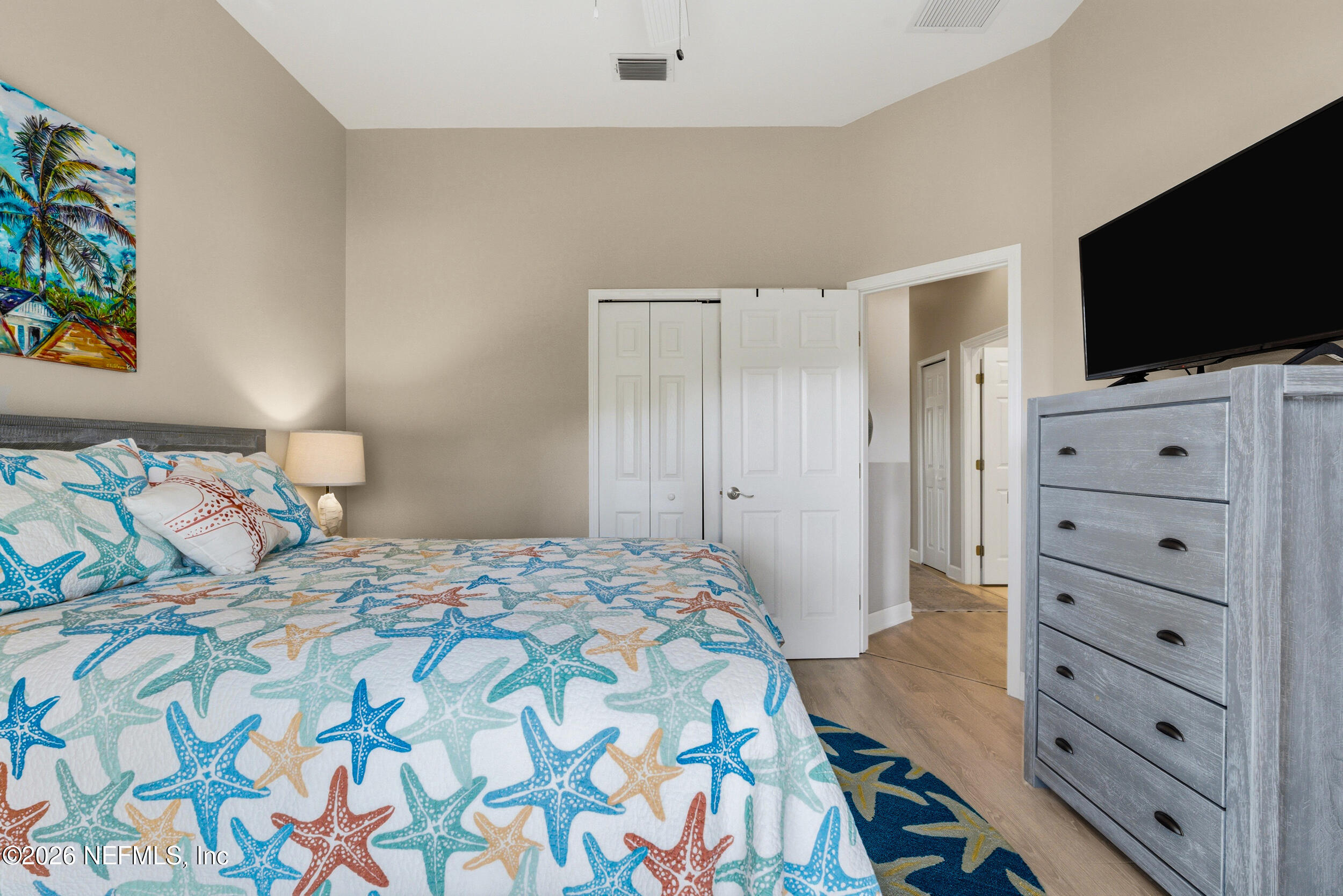 118 3rd Street St. Augustine, FL 32084 - Photo 40 of 77 a bedroom with a bed and a flat screen tv