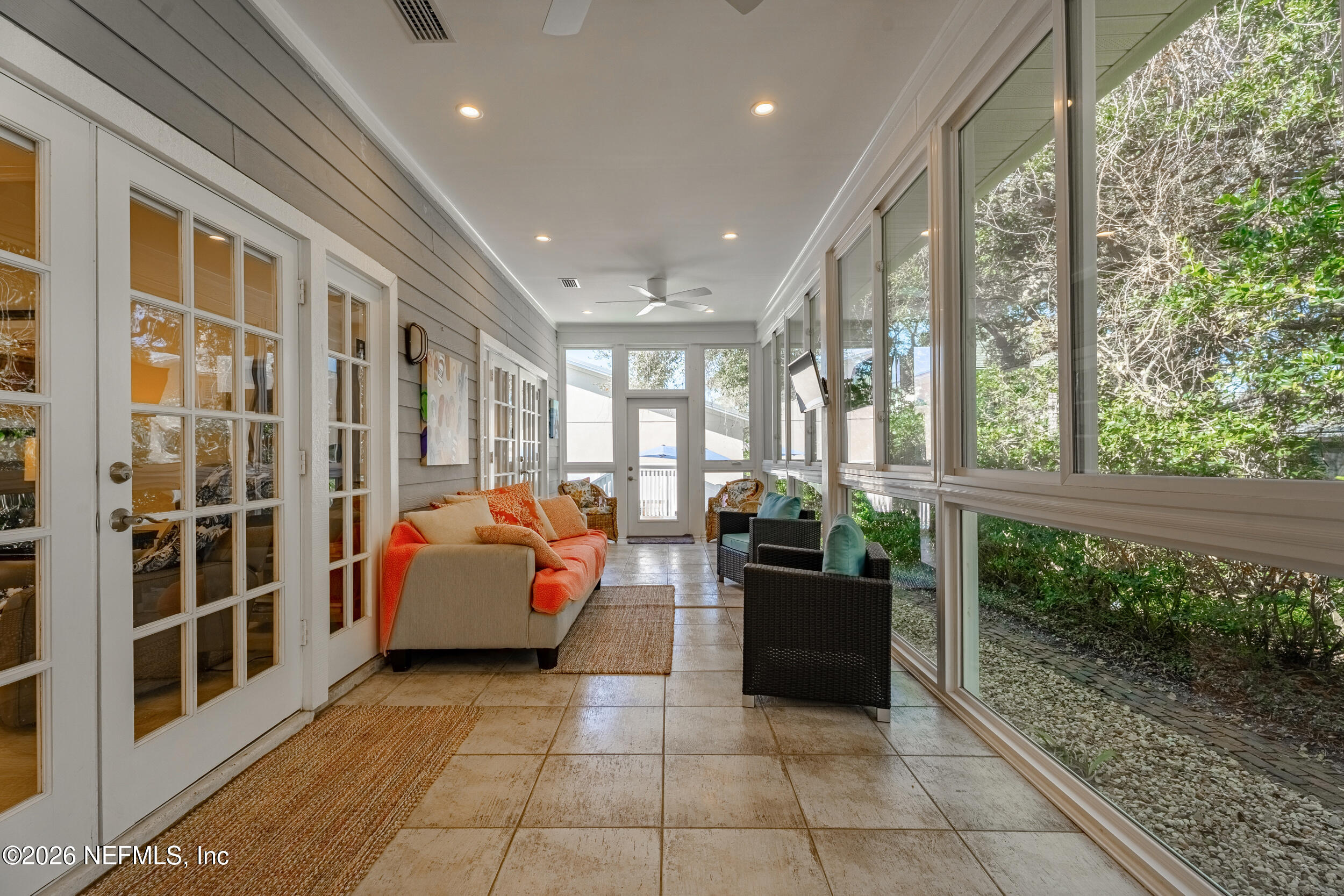 118 3rd Street St. Augustine, FL 32084 - Photo 43 of 77 a living room with furniture and large windows