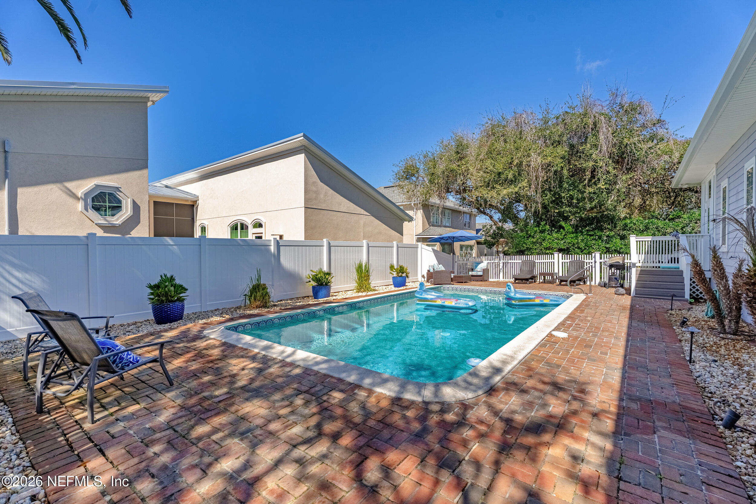 118 3rd Street St. Augustine, FL 32084 - Photo 53 of 77 a view of a house with backyard and sitting area