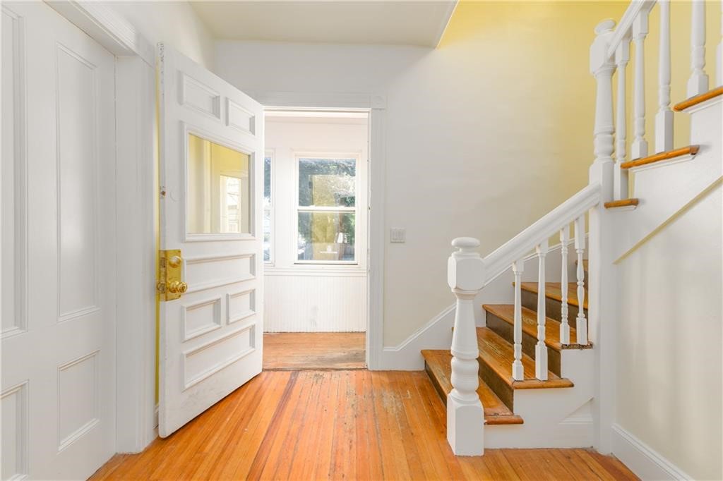 9 Ann Street Newport, RI 02840 - Photo 2 of 26 Entry foyer into hallway with access to Unit 1 (one level first floor) and stairs to Unit 2 (two level - floors 1 & 2)