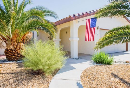 642 Regency Court Ridgecrest, CA 93555 - Photo 3 of 33 a front view of a house with a yard