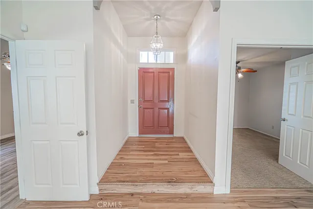 a spacious bedroom with a bed and window