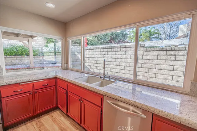 a view of a sink and a large window