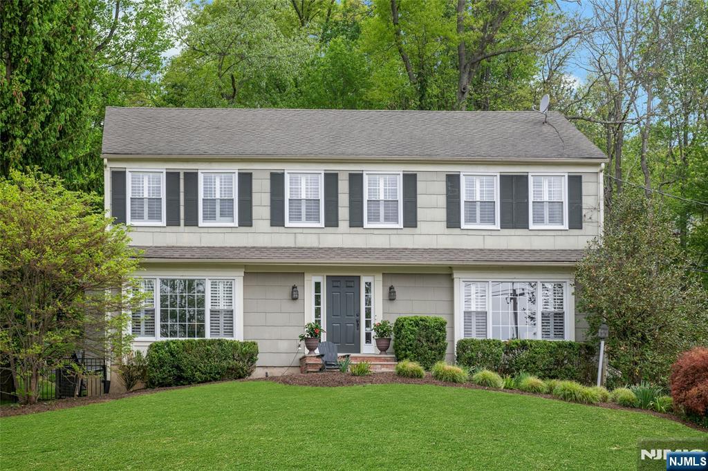 744 River Road Chatham, NJ 07928 - Photo 1 of 19 front view of a house with a yard