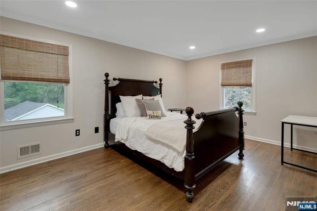 744 River Road Chatham, NJ 07928 - Photo 11 of 19 a bed sitting in a spacious bedroom next to a window
