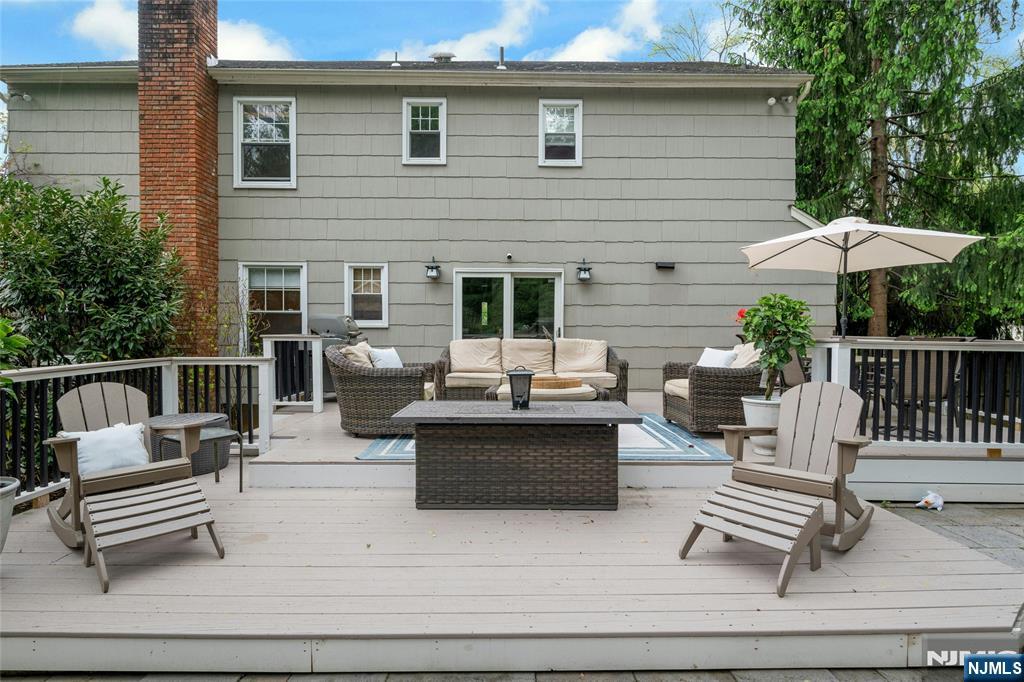 744 River Road Chatham, NJ 07928 - Photo 16 of 19 a view of a patio with couches chairs and wooden floor
