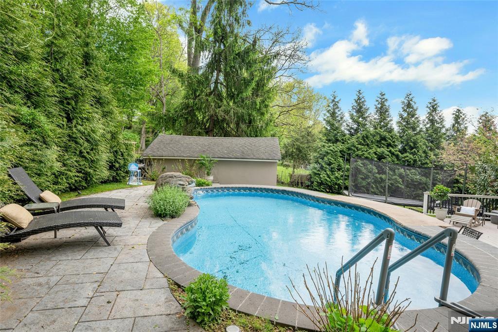744 River Road Chatham, NJ 07928 - Photo 18 of 19 swimming pool view with a seating space