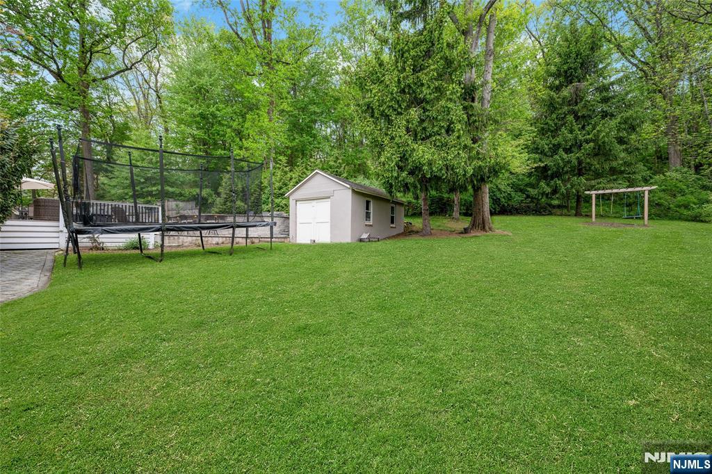 744 River Road Chatham, NJ 07928 - Photo 19 of 19 a view of a house with a backyard
