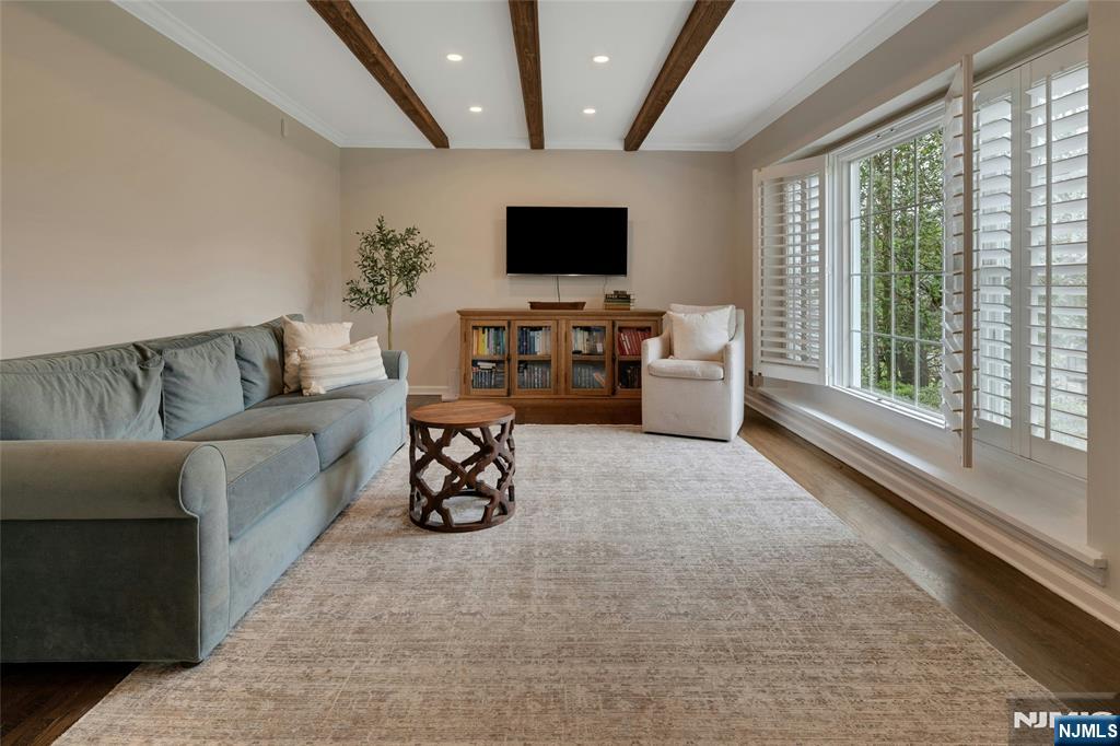 744 River Road Chatham, NJ 07928 - Photo 3 of 19 a living room with furniture and a flat screen tv