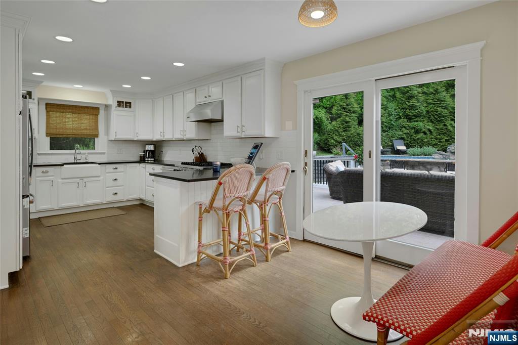744 River Road Chatham, NJ 07928 - Photo 6 of 19 a kitchen with a sink and a stove top oven