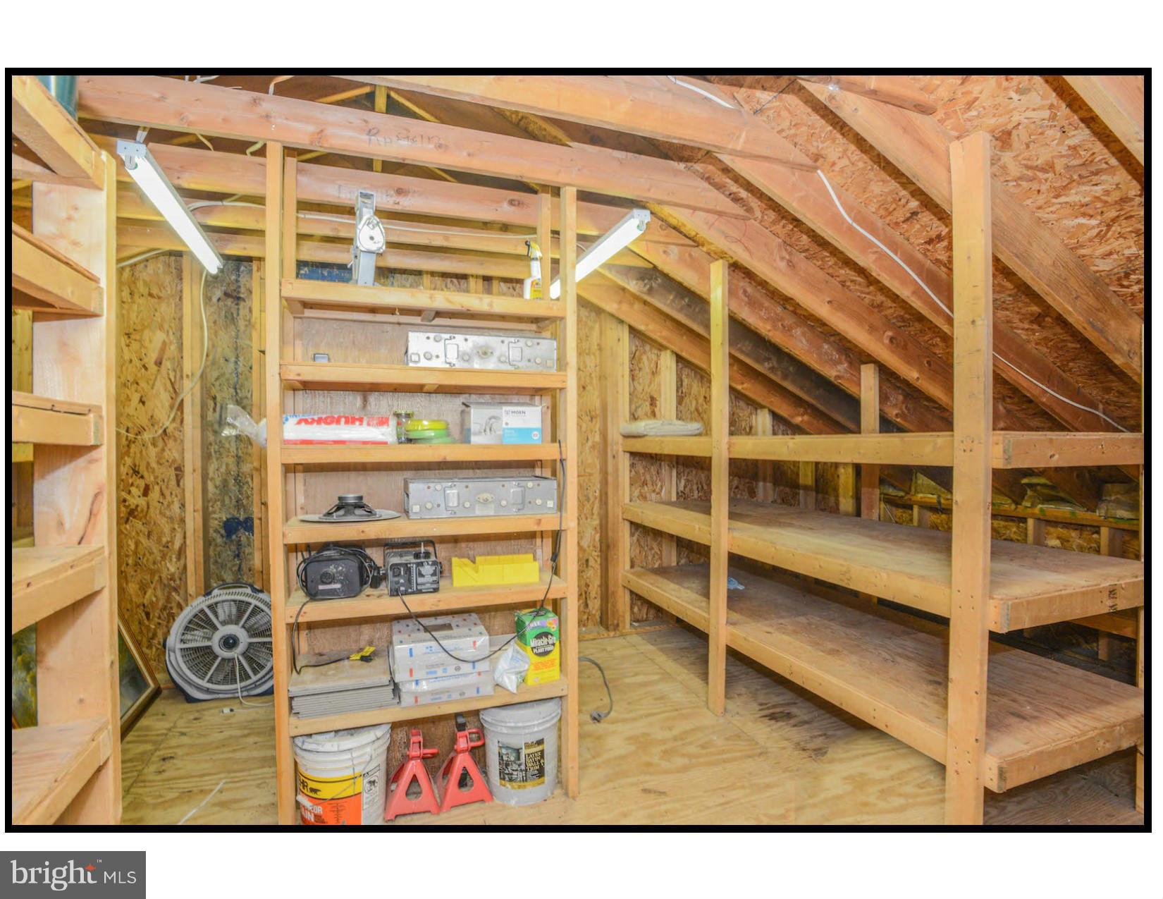 6914 Fox Chase Road New Market, MD 21774 - Photo 22 of 26 Storage Space Above Garage with Built in Shelving