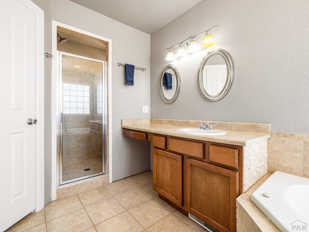 43948 Hunsaker Road Avondale, CO 81022 - Photo 24 of 56 a bathroom with a sink and a mirror