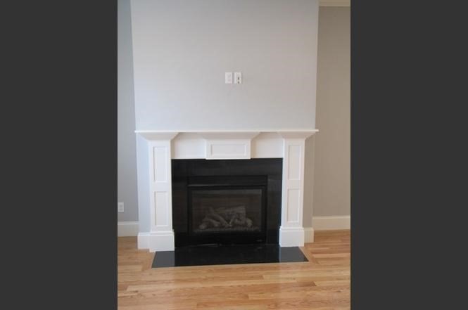 210 South Quinsigamond Avenue, Unit 1 Shrewsbury, MA 01545 - Photo 6 of 11 a living room with a fireplace